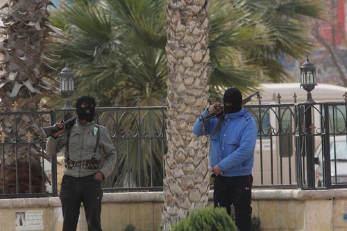 185148_two_masked_isis_islamic_state_in_iraq_and_syria_movement_fighters__IqRpp4i.jpg