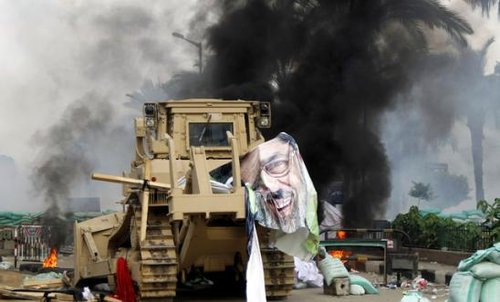 186818_torn_poster_of_deposed_egyptian_president_mursi_is_seen_as_riot_po_KwD9w7W.jpg
