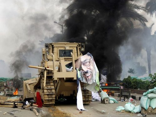 186818_torn_poster_of_deposed_egyptian_president_mursi_is_seen_as_riot_po_HwNUZ7E.jpg