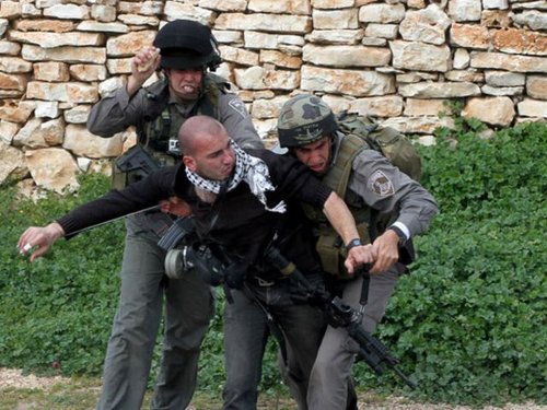 188207_bilal_jum_a_being_beaten_by_a_solider_in_a_peaceful_protest_in_kuf_XmY1vxu.jpg