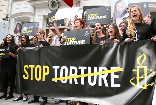 Activists hold a Stop Torture banner outside Mexico Embassy in solidarity with victims of torture.