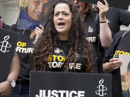 196928_stop_torture_-_woman_chanting.jpg