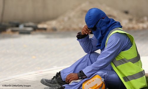 A construction worker takes a break from a building site in Doha, Qatar.
