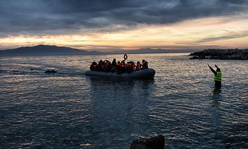 Refugees and migrants on an inflatable boat