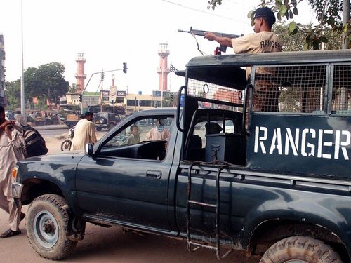 227737_a_pakistani_ranger_stands_alert_on_a_veh.jpg