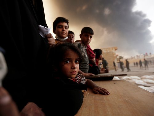 234482_newly_displaced_people_wait_to_receive_food_supplies_at_a_processi_VvB4Jog.jpg