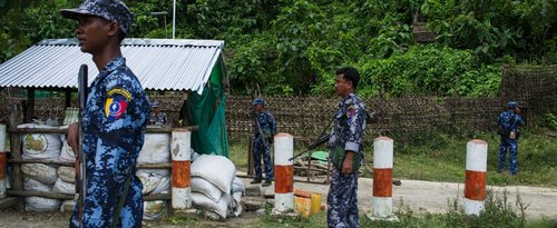Myanmar border police stand guard at the check point near the entrance of Maungdaw township in Myanmar's Rakhine State