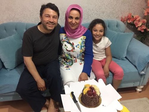 Taner Kılıç, the Chair of Amnesty Turkey, with his wife and daughter, before his arrest .