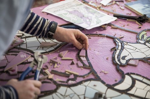 Artist Carrie Reichardt working on the ceramic mural entitled ‘Suffragette Spirit' at her studio in West London