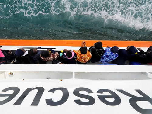 Refugees and migrants wait to disembark from Aquarius in the Sicilian harbour of Catania - May 2018