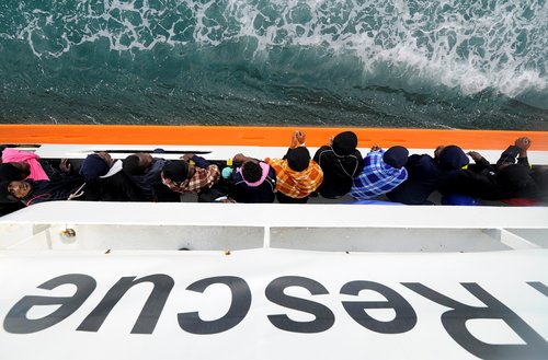Migrants wait to disembark from Aquarius in the Sicilian harbour of Catania, Italy, May 27, 2018