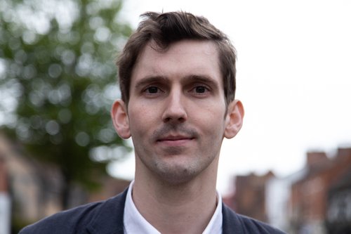 Tom Ciotkowski recorded on his mobile phone an official pushing and kicking a volunteer in Calais last year