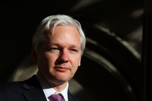WikiLeaks founder Julian Assange speaks to the media outside the High Court in London on December 5, 2011