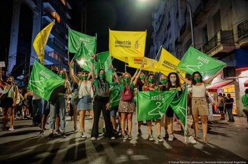 Image shows Amnesty activists in a protest for reproductive rights.