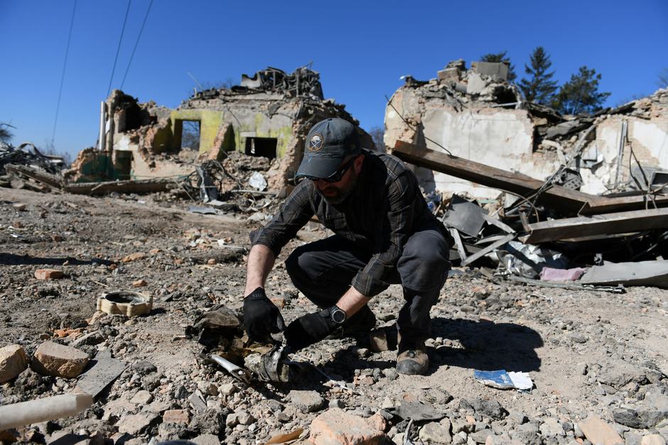 Brian Castner, Senior Crisis Adviser and Weapons Investigator with Amnesty International's Crisis Response team, carries out a field investigation in Rivne, Ukraine in March 2022.