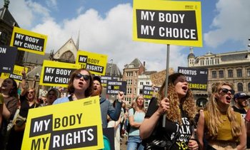 Amnesty International activists holding My Body, My Rights/Choice placards stage abortion rights protest in the Netherlands