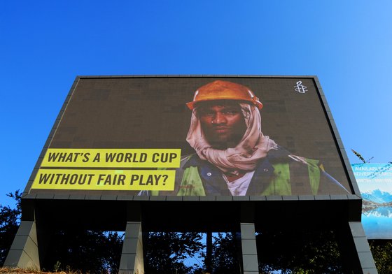 Pay Up Fifa 2022 Billboard in Kathmandu, Nepal, December 2022. Part of Amnesty International's campaigning work on migrant workers' rights ahead at the 2022 World Cup in Qatar.