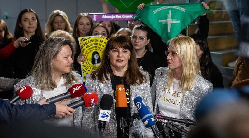 Justyna speaking to media