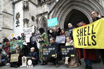 Activists and speakers - including King Okabi of the Ogale community - call for an end to Shell's pollution of the Niger Delta and compensation outside the Royal Courts of Justice in London, on day one of the Ogale and Bille communities vs Shell trial, 13