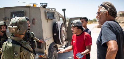 Awda Al-Hathaleen talking to the IDF