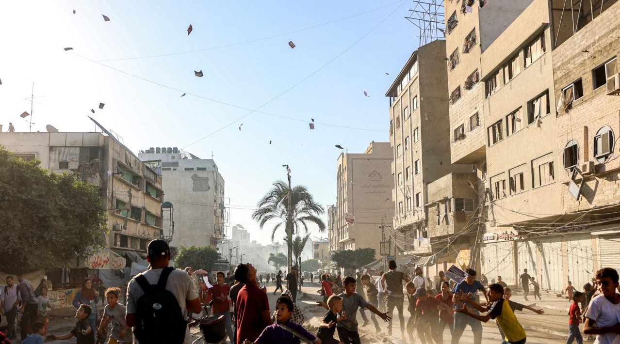 Image shows sunset over a destroyed Jabalia, Gaza