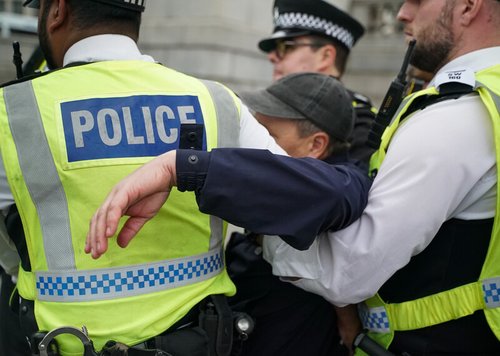 Protester being arrested by police