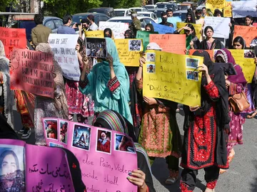 Activists from Baloch Students Council display banners as participate in a protest demanding the release of Mahrang Baloch, one of Pakistan's most prominent human rights advocates, along with missing Baloch persons, in Lahore on March 23, 2025.