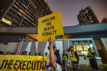 Amnesty International activists hold a banner in solidarity with Pannir Selvam, a Malaysian man awaiting execution for drug trafficking, outside Singapore's embassy in Kuala Lumpur, Malaysia, on May 6, 2025.