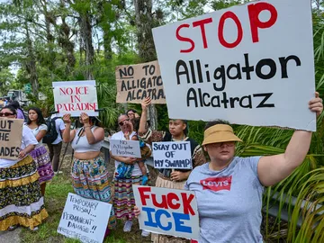 Demonstrators protest the construction of an immigrant detention center, dubbed "Alligator Alcatraz," in the Everglades near Ochopee, Florida, on June 28, 2025.