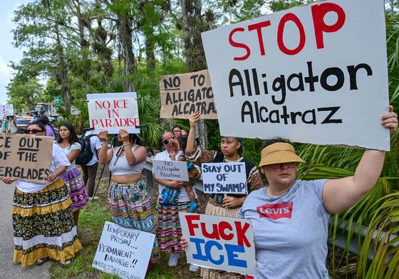 Demonstrators protest the construction of an immigrant detention center, dubbed "Alligator Alcatraz," in the Everglades near Ochopee, Florida, on June 28, 2025.