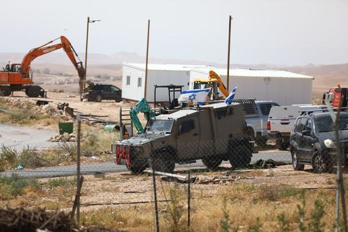 Illegal Israeli settlers expand an outpost in the West Bank's Umm al-Khair