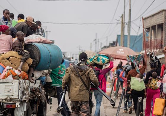 A Wazalendo (Patriots in Swahili) militiaman, part of a group of pro-government militias, retreats alongside residents as they flee from Kibati, where fighting has intensified, towards the city of Goma on January 26, 2025.