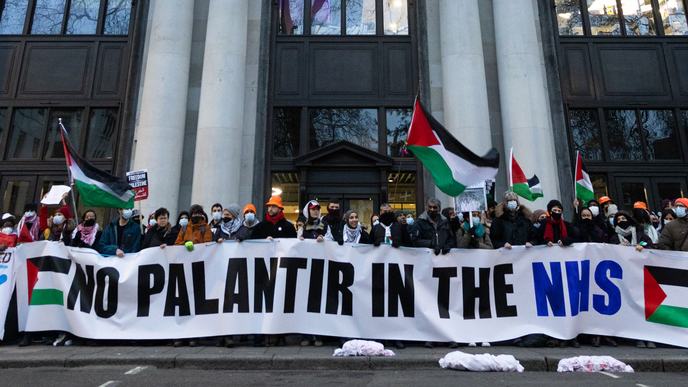 People holding a banner that reads No Palantir in the NHS