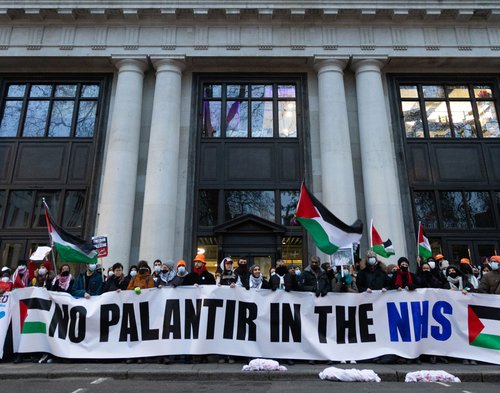 People holding a banner that reads No Palantir in the NHS