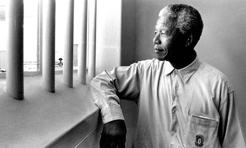 Nelson Mandela revisits his cell on Robben Island in 1994
