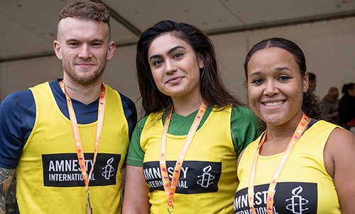 Three runners with medals at the Hackney Half Marathon