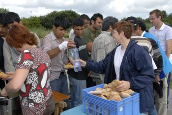 Volunteers distribute food to refugees and asylum seekers in northern France