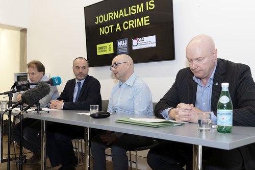 l-r: Daniel Holder, CAJ, Patrick Corrigan, Amnesty International, and Barry McCaffrey, Journalist, and Ian McGuinness, NUJ Irish Organiser, address a press conference, Belfast – March 6 2024