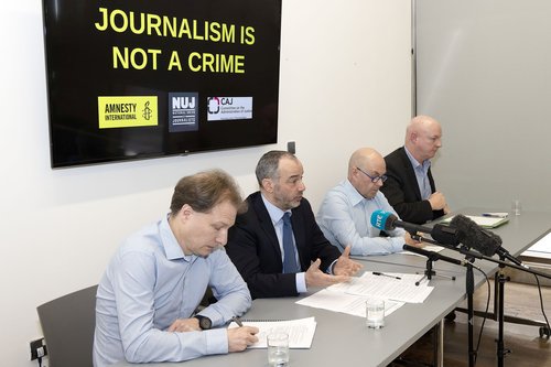l-r: Daniel Holder, CAJ, Patrick Corrigan, Amnesty International, and Barry McCaffrey, Journalist, and Ian McGuinness, NUJ Irish Organiser, address a press conference, Belfast – March 6 2024