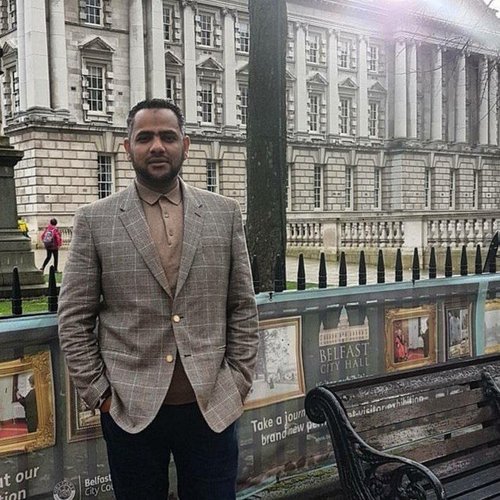 A photo of Ahmed al-Doush posing for a family photo before he was imprisoned