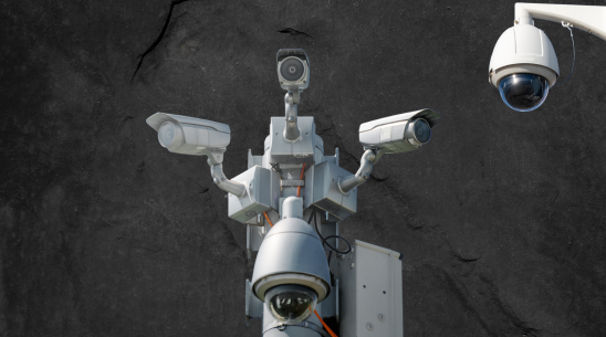 "On a dark grey background, there are cut out images of 5 CCTV cameras to evoke the surveillance this community are under""