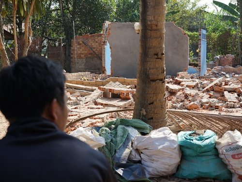 Cambodia20forced20evictions20w20man20looking20on_0.jpg