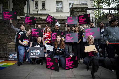 Amnesty International and Stonewall activists gather outside the Russian Embassy in London to hand in petition.