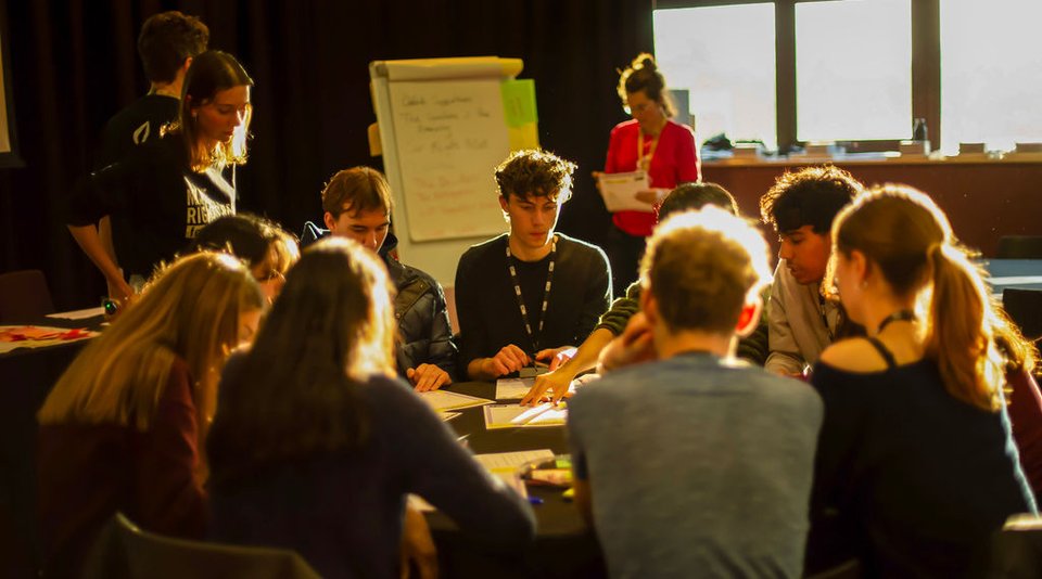 Children take part in group work as part of Amnesty's Children's network