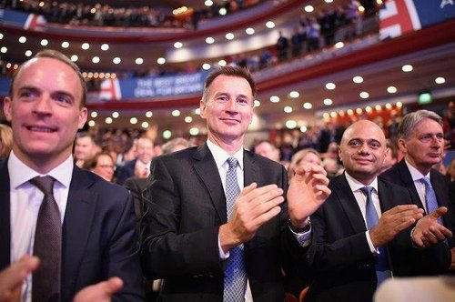 Cabinet Ministers (L-R) Dominic Raab, Jeremy Hunt, Sajid Javid and Philip Hammond clap ahead of British Prime Minister Theresa May's speech on the final day of the Conservative Party Conference at The International Convention Centre on October 3, 2018 in Birmingham, England.