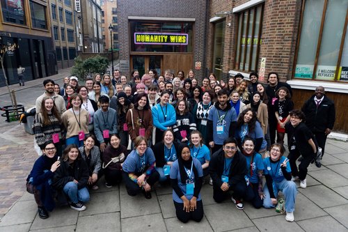 A group of students posing for a photo outside Amnesty UK's London office