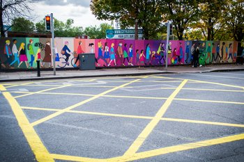 Colourful wall art depicting people of all ages, ethnicities, backgrounds and abilities