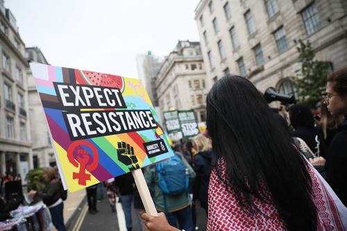 Activists showing solidarity during Donald Trump's 2025 UK visit.