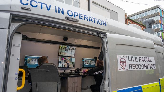 Police officers watch monitors in a live facial recognition van on the High Street on December 7, 2024 in Southend, England, United Kingdom. Essex Police today deployed two live facial recognition vans along the High Street. (Photo by John Keeble/Getty…