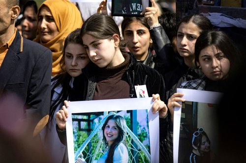 People gather for a mass demonstration in Syria's northeastern city of Qamishli on March 11, 2025 protesting against a recent wave of sectarian violence targeting Syria's Alawite minority in the west of the country along the Mediterranean sea coast